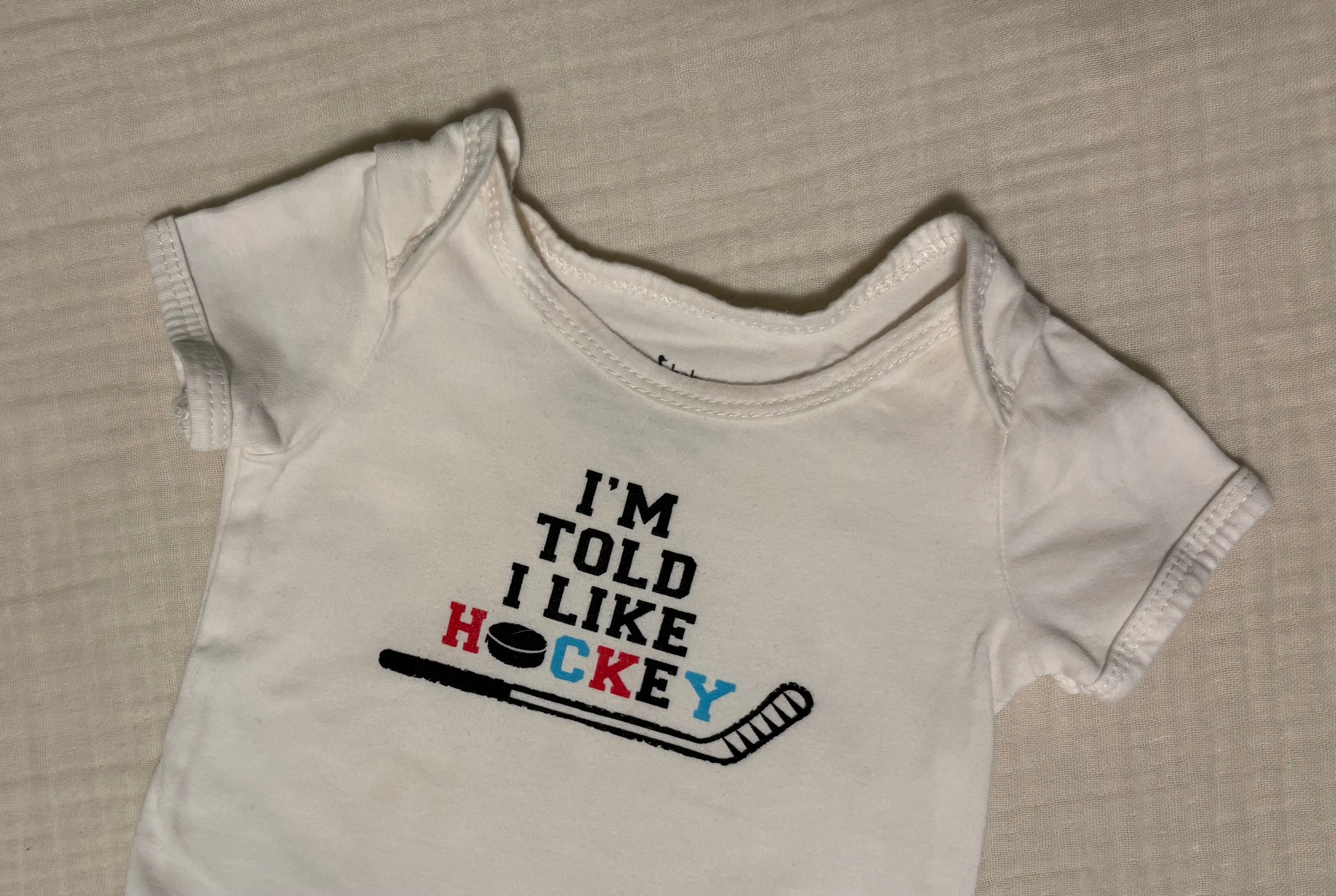 "I'm Told I Like Hockey" 3-6 Months Unisex Short Sleeved Onesie , Kids 6 Month (3-6M)