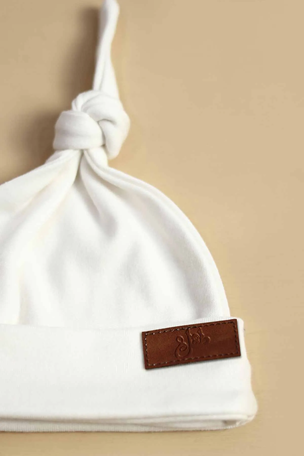 Solid White Knotted Baby Cap